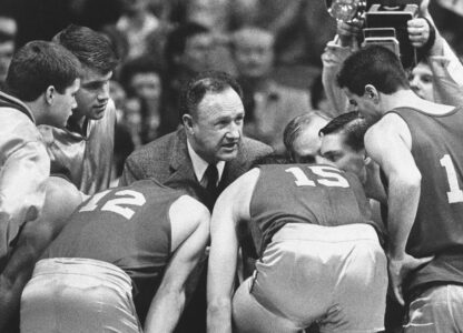FILE - Actor Gene Hackman gives fictional Hickory High basketball players instructions during filming of the final game of the movie 