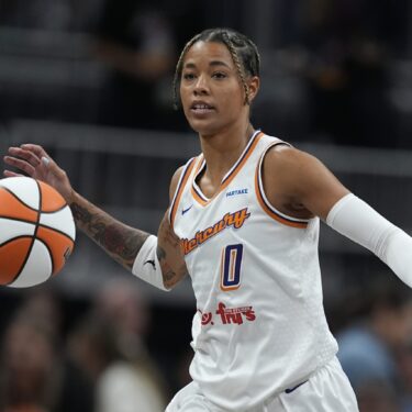 FILE - Phoenix Mercury's Natasha Cloud dribbles during the first half of a WNBA basketball game against the Indiana Fever in Indianapolis, on Friday, Aug. 16, 2024. (AP Photo/Darron Cummings, File)