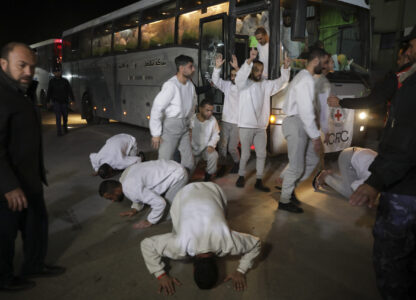 Freed Palestinian prisoners react as they arrive in the Gaza Strip after being released from an Israeli prison following a ceasefire agreement between Hamas and Israel in Khan Younis, Gaza Strip, Thursday, Feb. 27, 2025. (AP Photo/Jehad Alshrafi)