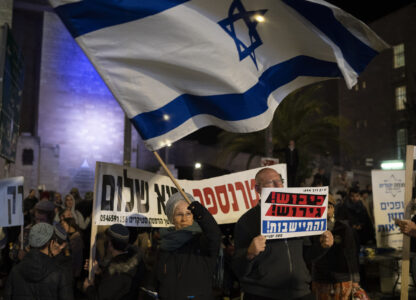 Israelis take part in protest demanding the continuation of the war against Hamas and the resettlement of the Gaza Strip, in Jerusalem, Thursday, Feb. 27, 2025. (AP Photo/Leo Correa)