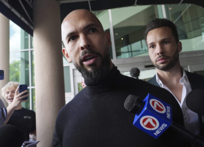 Influencer brothers Andrew and Tristan Tate arrive, Thursday, Feb. 27, 2025, in Fort Lauderdale, Fla. The brothers were charged with human trafficking in Romania and arrived in the U.S. after authorities lifted travel restrictions. (AP Photo/Marta Lavandier)