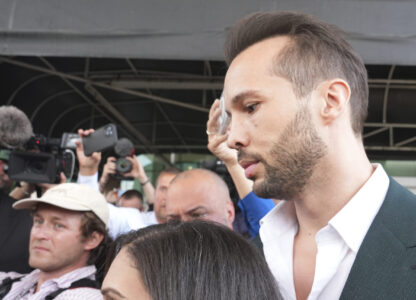 Tristan Tate arrives, Thursday, Feb. 27, 2025, in Fort Lauderdale, Fla. Tristan and his brother Andrew were charged with human trafficking in Romania and arrived in the U.S. after authorities lifted travel restrictions. (AP Photo/Marta Lavandier)