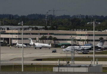 The plane carrying influencer brothers Andrew and Tristan Tate have arrives in Fort Lauderdale, Fla. from Romania on Thursday, Feb. 27, 2025. (AP Photo/Jennifer Lett)