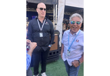 Dan Towriss, the new owner of Andretti Global, laughs with Mario Andretti before the IndyCar Series season-opening race, Sunday, March 2, 2025, in St. Petersburg, Fla. (AP Photo/Jenna Fryer)