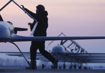A Ukrainian serviceman of the Defence Intelligence prepares to launch long-range drones An-196 Liutyi in undisclosed location, Ukraine, Feb. 28, 2025. (AP Photo/Evgeniy Maloletka)