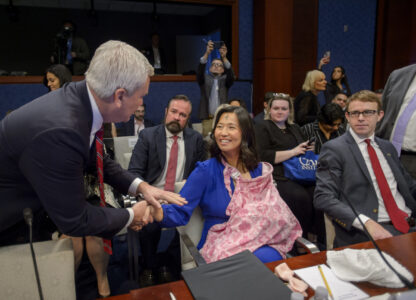 David J. Bier, right, Director of Immigration Studies at the Cato Institute lwatches as Boston Mayor Michelle Wu, center, nurses her daughter Mira while greeted by Chairman Rep. James Comer, R-Ky., left, before a House Committee on Oversight and Government Reform hearing with Sanctuary City Mayors on Capitol Hill, Wednesday, March 5, 2025, in Washington. (AP Photo/Rod Lamkey, Jr.)