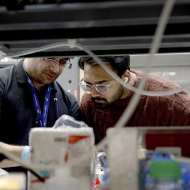 Lab workers at Johns Hopkins University work in Richard Huganir's lab in Baltimore, Md., on Feb. 26, 2025. (AP Photo/Shelby Lum)
