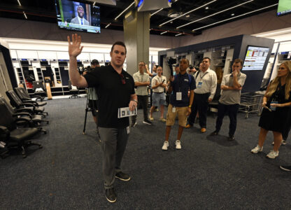 New York Yankees director of baseball operations Matthew Ferry, left, talks with the media in the newly completed Yankees clubhouse during a tour of the upgraded team spring training facilities Thursday, Feb. 13, 2025, at George M. Steinbrenner Field in Tampa, Fla. (AP Photo/Steve Nesius)