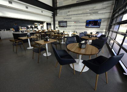 Members of the media check out a dining area next to the New York Yankees clubhouse kitchen during a tour of the upgraded team spring training facilities Thursday, Feb. 13, 2025, at George M. Steinbrenner Field in Tampa, Fla. (AP Photo/Steve Nesius)