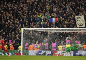 PSG's goalkeeper Gianluigi Donnarumma saves a penalty from Liverpool's Darwin Nunez during a shootout at the end of the Champions League round of 16 second leg soccer match between Liverpool and Paris Saint-Germain at Anfield in Liverpool, England, Tuesday, March 11, 2025. (AP Photo/Dave Thompson)