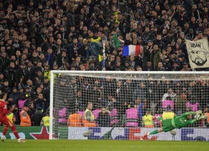 PSG's goalkeeper Gianluigi Donnarumma saves a penalty from Liverpool's Darwin Nunez during a shootout at the end of the Champions League round of 16 second leg soccer match between Liverpool and Paris Saint-Germain at Anfield in Liverpool, England, Tuesday, March 11, 2025. (AP Photo/Dave Thompson)