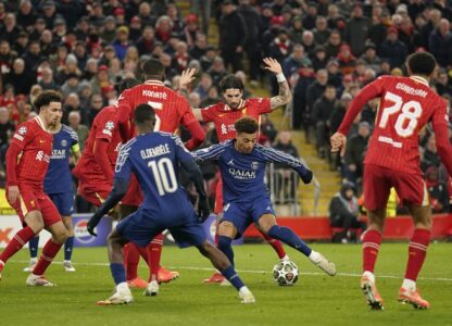 PSG's Desire Doue goes close with a shot during the Champions League round of 16 second leg soccer match between Liverpool and Paris Saint-Germain at Anfield in Liverpool, England, Tuesday, March 11, 2025. (AP Photo/Dave Thompson)