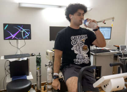 College student and research subject Sam Srisatta pedals on a stationary bicycle as part of an exercise session during a study on the health effects of ultraprocessed foods at the National Institutes of Health in Bethesda, Md., on Thursday, Oct. 31, 2024. (AP Photo/Mark Schiefelbein)