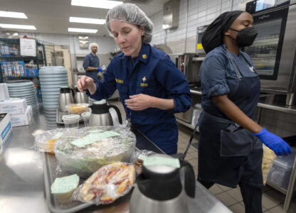 From left, cook Jeff Tait, nutrition research manager Merel Kozlosky, and research dietitian Sharonne Waters prepare a meal for college student and research subject Sam Srisatta in a kitchen as part of a study on the health effects of ultraprocessed foods at the National Institutes of Health in Bethesda, Md., on Thursday, Oct. 31, 2024. (AP Photo/Mark Schiefelbein)