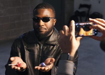 Isaac Ukwu, a defensive end for the Detroit Lions, acts out a scene from 