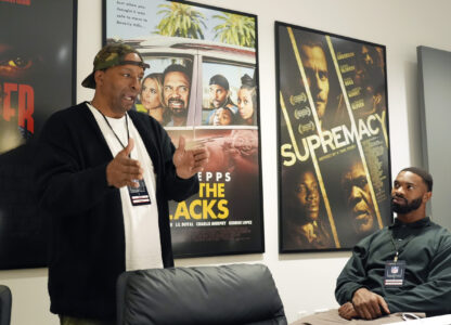 Filmmaker and former professional basketball player Deon Taylor, left, discusses the movie industry with Las Vegas Raiders linebacker K'Lavon Chaisson during a filmmaking workshop for NFL players on Tuesday, March 4, 2025, in Santa Monica, Calif. (AP Photo/Chris Pizzello)