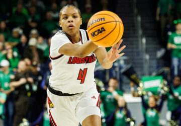 FILE - Louisville forward Mackenly Randolph (4), one of six women from Kobe Bryant’s Mamba Academy going through their first experience with college basketball, passes the ball during the first half of an NCAA college basketball game against Notre Dame, Sunday, March 2, 2025, in South Bend, Ind. (AP Photo/John Mersits, File)
