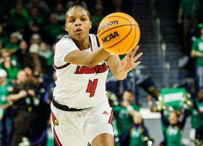 FILE - Louisville forward Mackenly Randolph (4), one of six women from Kobe Bryant’s Mamba Academy going through their first experience with college basketball, passes the ball during the first half of an NCAA college basketball game against Notre Dame, Sunday, March 2, 2025, in South Bend, Ind. (AP Photo/John Mersits, File)