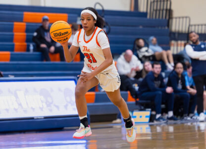In this image provided by Orange Coast College, Orange Coast College's Zoie Lamkin, one of six women from Kobe Bryant’s Mamba Academy going through their first experience with college basketball, dribbles down court during a college basketball game against Cerro Coso, Saturday, March 8, 2025, in Costa Mesa, Calif. (Liam Davis/Orange Coast College via AP)