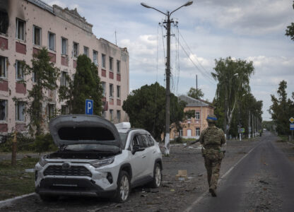 FILE - A Ukrainian soldier walks past at a city hall in Sudzha, Kursk region, Russia, Friday, Aug. 16, 2024. This image was approved by the Ukrainian Defense Ministry before publication. (AP Photo, File)
