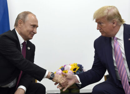 FILE - President Donald Trump, right, shakes hands with Russian President Vladimir Putin, left, during a bilateral meeting on the sidelines of the G-20 summit in Osaka, Japan, June 28, 2019. (AP Photo/Susan Walsh, File)
