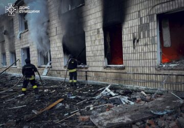 In this photo provided by the Ukrainian Emergency Service on Wednesday, March 19, 2025, firefighters work on a site of a Russian attack in Krasnopillia, Sumy region, Ukraine. (Ukrainian Emergency Service via AP)