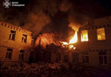 In this photo provided by the Ukrainian Emergency Service on Wednesday, March 19, 2025, fire and smoke engulf a building after a Russian attack in Krasnopillia, in the Sumy region of Ukraine. (Ukrainian Emergency Service via AP)
