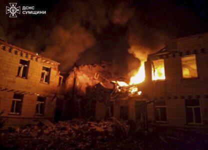 In this photo provided by the Ukrainian Emergency Service on Wednesday, March 19, 2025, fire and smoke engulf a building after a Russian attack in Krasnopillia, in the Sumy region of Ukraine. (Ukrainian Emergency Service via AP)