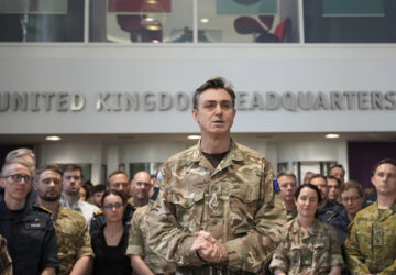 General Nick Perry Chief of Joint Operations, left speaks during a visit of Britain's Prime Minister Keir Starmer at a military base to meet planners mapping out next steps in the Coalition of the Willing in Northwood, London, Thursday, March 20, 2025.(AP Photo/Alastair Grant, Pool)