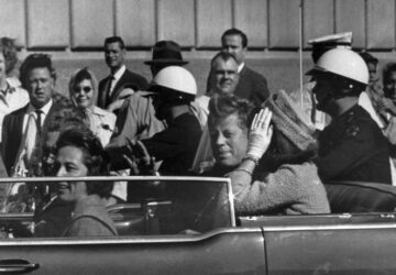 FILE - This Nov. 22, 1963 file photo shows President John F. Kennedy riding in motorcade with first lady Jacqueline Kenndy in Dallas, Texas. (AP Photo, file)