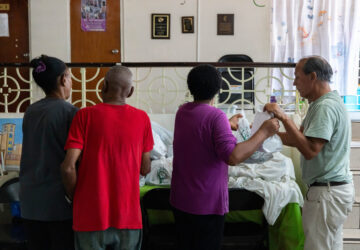 Volunteers at San Pablo Methodist Church pack food into bags to donate to the immigrant community in Barrio Obrero, San Juan, Puerto Rico, Friday, March 14, 2025. (AP Photo/Alejandro Granadillo)