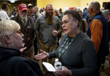 FILE - Rep. Harriet Hageman, R-Wyo., talks to attendees after holding a town hall meeting, March 14, 2025, in Evanston, Wyo. (AP Photo/Spenser Heaps, File)