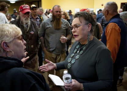 FILE - Rep. Harriet Hageman, R-Wyo., talks to attendees after holding a town hall meeting, March 14, 2025, in Evanston, Wyo. (AP Photo/Spenser Heaps, File)