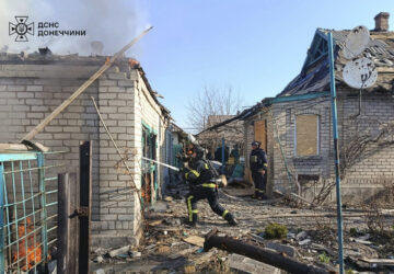 In this photo provided by the Ukrainian Emergency Service, firefighters put out the fire following a Russian attack in Donetsk region, Ukraine, Monday, March 24, 2025. (Ukrainian Emergency Service via AP)