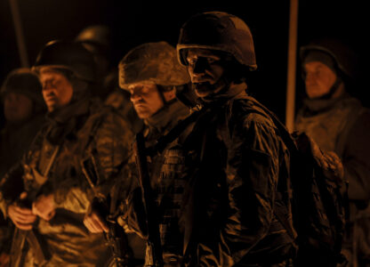 In this photo taken on March 21, 2025 and provided by Ukraine's 24th Mechanized Brigade press service on March 24, 2025, servicemen attend a dedication ceremony for soldiers near the frontline in the Donetsk region, Ukraine. (Oleg Petrasiuk/Ukraine's 24th Mechanized Brigade via AP)