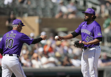 Colorado Rockies manager Bud Black (10) takes the ball from starting pitcher Germán Márquez (48) during the third inning of a spring training baseball game against the San Francisco Giants, Monday, March 10, 2025, in Scottsdale, Ariz. (AP Photo/Ross D. Franklin)