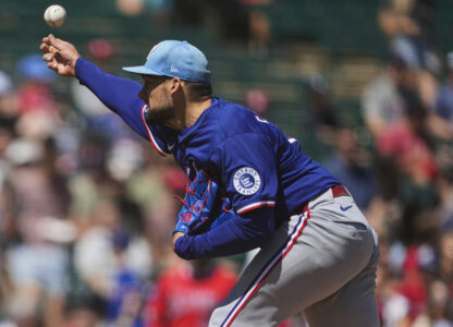 Texas Rangers pitcher Nathan Eovaldi throws against the Los Angeles Angels during the second inning of a spring training baseball game, Friday, March 21, 2025, in Tempe, Ariz. (AP Photo/Matt York)