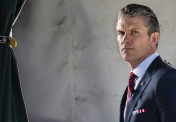 Defense Secretary Pete Hegseth does a television interview outside the White House, Friday, March 21, 2025, in Washington. (AP Photo/Jacquelyn Martin)