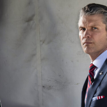 Defense Secretary Pete Hegseth does a television interview outside the White House, Friday, March 21, 2025, in Washington. (AP Photo/Jacquelyn Martin)