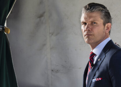 Defense Secretary Pete Hegseth does a television interview outside the White House, Friday, March 21, 2025, in Washington. (AP Photo/Jacquelyn Martin)