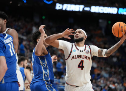Auburn forward Johni Broome (4) looks to shoot during the first half in the second round of the NCAA college basketball tournament, Saturday, March 22, 2025, in Lexington, Ky. (AP Photo/Brynn Anderson)