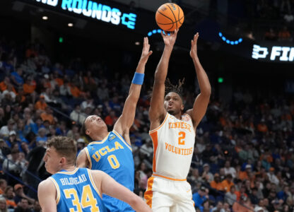 Tennessee guard Chaz Lanier (2) shoots against UCLA guard Kobe Johnson (0) during the second half in the second round of the NCAA college basketball tournament, Saturday, March 22, 2025, in Lexington, Ky. (AP Photo/Brynn Anderson)