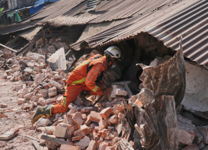 A rescuer works through rubble of a collapsed building following Friday's earthquake in Naypyitaw, Myanmar, Tuesday, April 1, 2025. (AP Photo)
