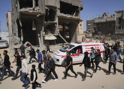Mourners follow the convoy carrying the bodies of 8 Red Crescent emergency responders, recovered in Rafah a week after an Israeli attack, as they are transported for burial in Deir al-Balah, Gaza Strip, on Monday, March 31, 2025. (AP Photo/Abdel Kareem Hana)