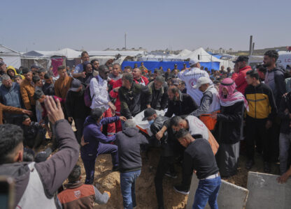 Mourners carry the bodies of 8 Red Crescent emergency responders, recovered in Rafah a week after an Israeli attack, during their funeral in Deir al-Balah, Gaza Strip, on Mon day, March 31, 2025. (AP Photo/Abdel Kareem Hana)