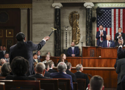 Rep. Al Green, D-Texas, left, shouts as President Donald Trump addresses a joint session of Congress at the Capitol in Washington, Tuesday, March 4, 2025. (Win McNamee/Pool Photo via AP)