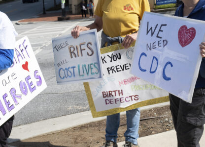 People protest outside of the Centers for Disease Control and Prevention in Atlanta on Tuesday, April 1, 2025 after layoffs were announced. (AP Photo/Ben Gray)
