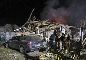 FILE - Rescuers work on site of a residential building destroyed by a Russian drone strike in Zaporizhzhia, Ukraine, March 21, 2025. (AP Photo/Kateryna Klochko, File)