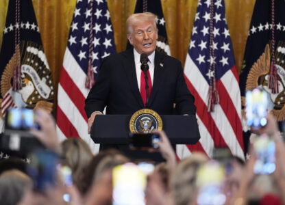 FILE - President Donald Trump speaks at a reception celebrating Women's History Month in the East Room of the White House, Wednesday, March 26, 2025, in Washington. (AP Photo/Mark Schiefelbein, File)