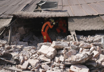 A rescuer works through rubble of a collapsed building following Friday's earthquake in Naypyitaw, Myanmar, Tuesday, April 1, 2025. (AP Photo)